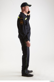 Sam Atkins Fireman with Mobilphone standing talking whole body 0007.jpg